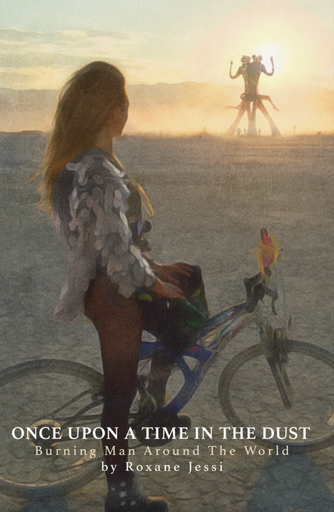 Book cover with woman on a bike at Black Rock City. 