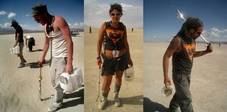 Two men and a woman working with pick-up tools during Playa Restoration 
