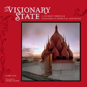 Red book cover with a picture of a Burning Man temple in the background