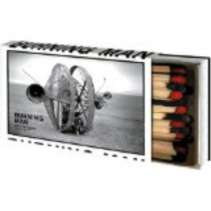A matchbook with matches sticking out, with a picture of a piece of Burning Man art on the front.