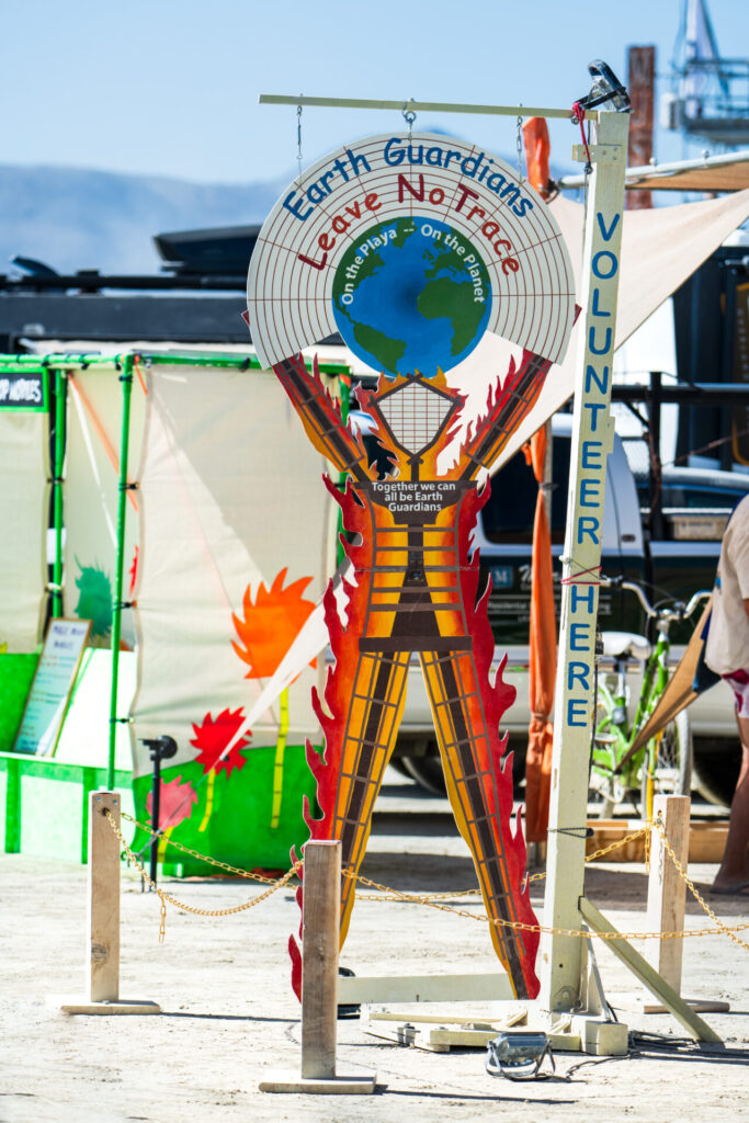 Leave No Trace sign with The Man art