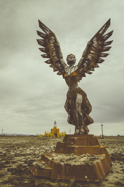 A sculpture of female figure with wings.