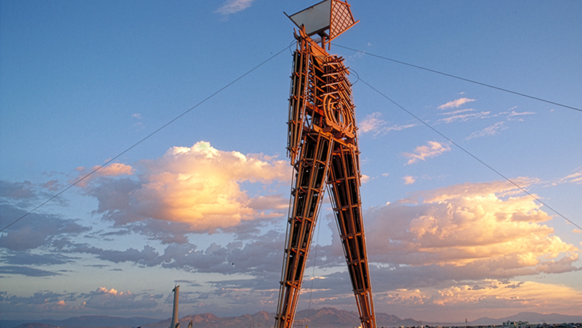 Burning Man effigy at sunrise on playa in 1995