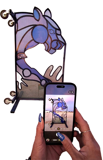 A cart turned on its side turned into a frame for stained glass style purple big cat head.
