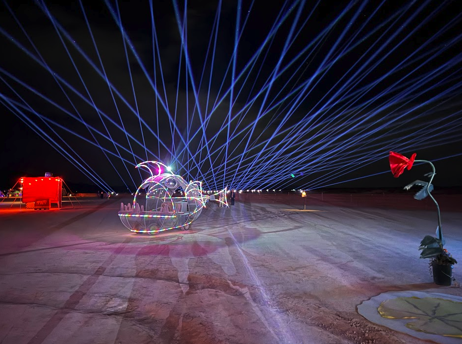 fish art car with lasers in back and red flower art