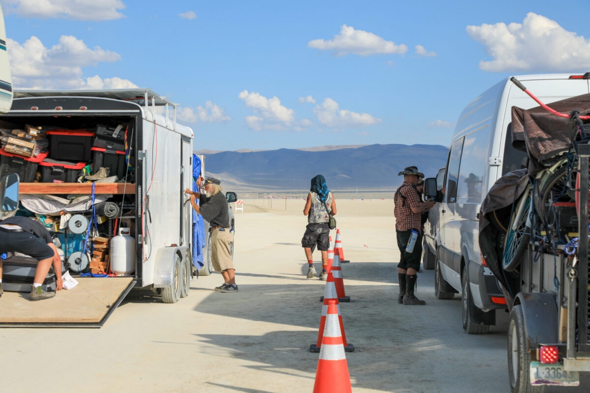 Vehicles open while gate crew look for stowaways and prohibited items.
