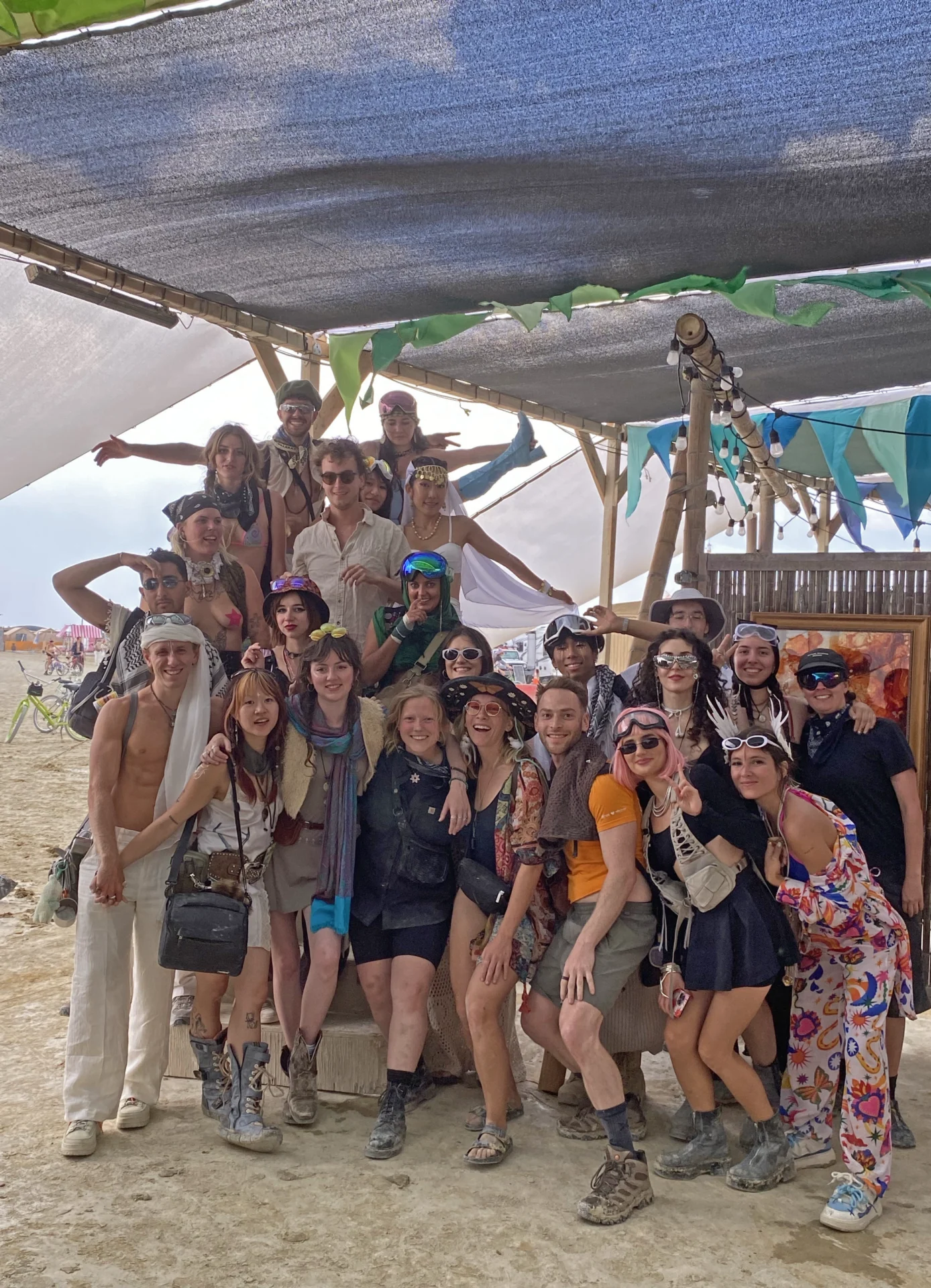 The Rising Sparks campers group photo under a shade canopy.